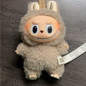 Adorable Tan Plush toy.